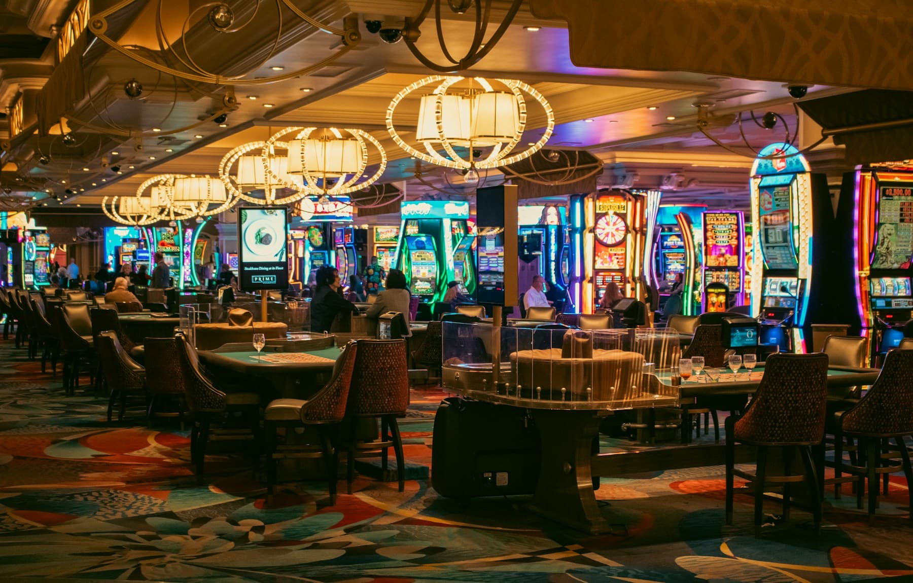 Elegant casino interior with blue ambient light and chandeliers