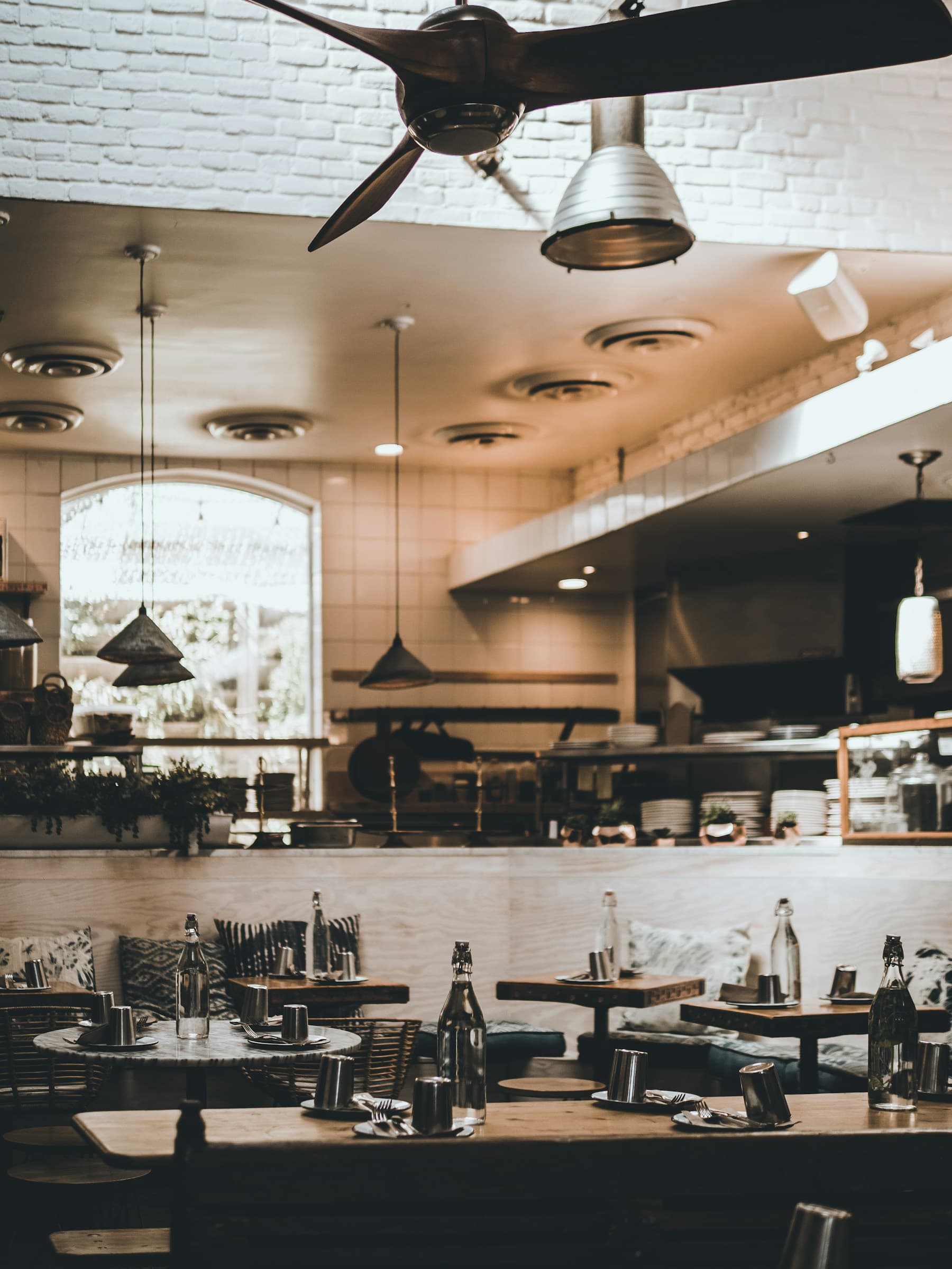 Warm modern restaurant interior prepared for an exclusive dining experience
